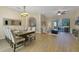 Spacious living area featuring wood floors and a view of the screened-in pool at 419 Coventry Rd, Davenport, FL 33897