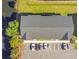 Overhead view of a community building, parking lot, and surrounding landscaping at 4314 Pershing Pointe Pl # 4, Orlando, FL 32822
