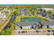 Condominium community with landscaped grounds and a tranquil pond at 4314 Pershing Pointe Pl # 4, Orlando, FL 32822
