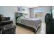 Comfortable bedroom with contemporary decor and ample natural light at 4314 Pershing Pointe Pl # 4, Orlando, FL 32822
