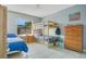 bedroom featuring a bunk bed, dresser, and a bright window at 4314 Pershing Pointe Pl # 4, Orlando, FL 32822