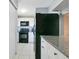 Modern kitchen featuring granite counters, white cabinets, and new appliances at 4314 Pershing Pointe Pl # 4, Orlando, FL 32822