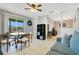 Cozy living space with round dining table and comfortable couch at 4314 Pershing Pointe Pl # 4, Orlando, FL 32822