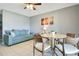 Cozy living space with round dining table and comfortable couch at 4314 Pershing Pointe Pl # 4, Orlando, FL 32822