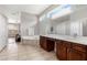 Bright bathroom featuring a soaking tub, double vanity, and stylish tile flooring at 504 Sonata Ct, Winter Springs, FL 32708