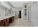 Large bathroom featuring a double vanity, shower, walk in closet, and lots of natural light at 504 Sonata Ct, Winter Springs, FL 32708