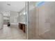 Bright bathroom featuring a glass-enclosed shower, a soaking tub, and stylish tile flooring at 504 Sonata Ct, Winter Springs, FL 32708