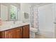 Well-lit bathroom featuring modern fixtures, including a stylish vanity and shower with a curtain at 504 Sonata Ct, Winter Springs, FL 32708
