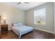Cozy bedroom with natural light, showcasing wood floors and neutral tones at 504 Sonata Ct, Winter Springs, FL 32708