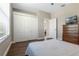 Bright bedroom features closet space, wood floors, and neutral paint at 504 Sonata Ct, Winter Springs, FL 32708
