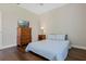 Comfortable bedroom with ample space, featuring wood floors and a dresser with a television at 504 Sonata Ct, Winter Springs, FL 32708