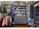 Walk-in closet with custom shelving and drawers, providing ample storage space at 504 Sonata Ct, Winter Springs, FL 32708