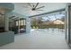 Covered lanai offering a peaceful view of the pool and landscaped backyard at 504 Sonata Ct, Winter Springs, FL 32708