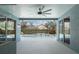Screened lanai featuring a ceiling fan overlooking a pool and outdoor landscaping at 504 Sonata Ct, Winter Springs, FL 32708