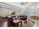 Open concept living room with fireplace, backyard views, and a dining area at 504 Sonata Ct, Winter Springs, FL 32708