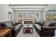 Living room with beamed ceilings, fireplace and access to a screened outdoor pool at 504 Sonata Ct, Winter Springs, FL 32708