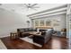 Living room with beamed ceilings, fireplace and access to a screened outdoor pool at 504 Sonata Ct, Winter Springs, FL 32708