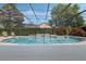 Screened-in pool and spa surrounded by lush landscaping providing a private backyard retreat at 504 Sonata Ct, Winter Springs, FL 32708