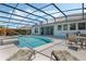 Lounge by the pool with seating, tanning chairs, and a view of the private backyard at 504 Sonata Ct, Winter Springs, FL 32708