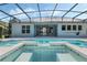 Expansive screened-in pool and patio area, great for outdoor living and entertaining with modern home exterior at 504 Sonata Ct, Winter Springs, FL 32708