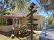 The backyard features plenty of wood and a directional sign at 511 Terrier Way, New Smyrna Beach, FL 32168