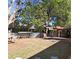 The backyard features a covered cooking area with a corrugated metal fence at 511 Terrier Way, New Smyrna Beach, FL 32168