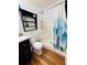Bathroom featuring a stall shower with light and dark blue curtain at 511 Terrier Way, New Smyrna Beach, FL 32168