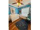 Bedroom with light blue cloud-themed walls and decor at 511 Terrier Way, New Smyrna Beach, FL 32168