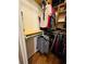 Walk-in closet providing ample storage space for clothes and accessories with custom wood shelf at 511 Terrier Way, New Smyrna Beach, FL 32168