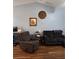 Inviting living room with vaulted ceilings, wood floors, and comfortable seating at 511 Terrier Way, New Smyrna Beach, FL 32168