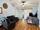 Bright living room featuring vaulted ceilings, wood floors, and sliding door access at 511 Terrier Way, New Smyrna Beach, FL 32168