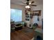 Office space with a desk, shelving, and natural light from a large window at 511 Terrier Way, New Smyrna Beach, FL 32168