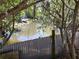 Beautiful water view framed by lush greenery and foliage at 511 Terrier Way, New Smyrna Beach, FL 32168