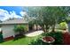 Beautiful backyard with stone patio, artificial turf and well placed landscaping at 5123 Santa Ana Dr, Orlando, FL 32837