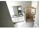 Well-lit bathroom boasts a double sink vanity with granite countertop and a walk-in shower at 5123 Santa Ana Dr, Orlando, FL 32837