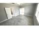 Bright bedroom with tiled floor and open doorways to other rooms at 5123 Santa Ana Dr, Orlando, FL 32837