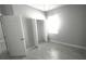 Comfortable bedroom features tile flooring, closet and a window for natural light at 5123 Santa Ana Dr, Orlando, FL 32837