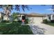Charming single-Gathering home with a well-manicured lawn, mature landscaping, and a two-car garage at 5123 Santa Ana Dr, Orlando, FL 32837
