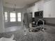 Bright eat-in kitchen with stainless steel appliances and granite countertops at 5123 Santa Ana Dr, Orlando, FL 32837