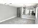 Bright and open living room flows into the kitchen with tile flooring throughout the home at 5123 Santa Ana Dr, Orlando, FL 32837