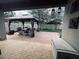 Inviting outdoor patio with a gazebo, perfect for entertaining guests in a private setting at 5123 Santa Ana Dr, Orlando, FL 32837