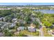 Spacious neighborhood with mature trees, a lake, and a view of the city skyline in the distance at 533 Baxter St, Orlando, FL 32806
