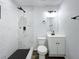 Modern bathroom with white marble-style tile in the shower, black fixtures, and a floating vanity at 533 Baxter St, Orlando, FL 32806