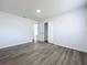 Spacious bedroom with neutral walls, wood-look floors, and ample natural light, creating a serene atmosphere at 533 Baxter St, Orlando, FL 32806