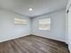 Comfortable bedroom with natural light, wood-look flooring, and a peaceful ambiance at 533 Baxter St, Orlando, FL 32806