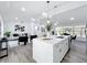 Open concept living space with kitchen island, dining and seating area at 533 Baxter St, Orlando, FL 32806