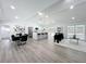 Open concept living space with modern gray floors, and a dining and kitchen area at 533 Baxter St, Orlando, FL 32806