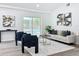 Bright living room featuring modern decor, stylish furniture, and a view of the sparkling outdoor pool at 533 Baxter St, Orlando, FL 32806