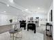 Open floor plan showcasing modern living space with kitchen, dining, and stylish seating area at 533 Baxter St, Orlando, FL 32806