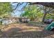 A view of the rear of a home with large backyard at 5386 Mustang Way, Orlando, FL 32810